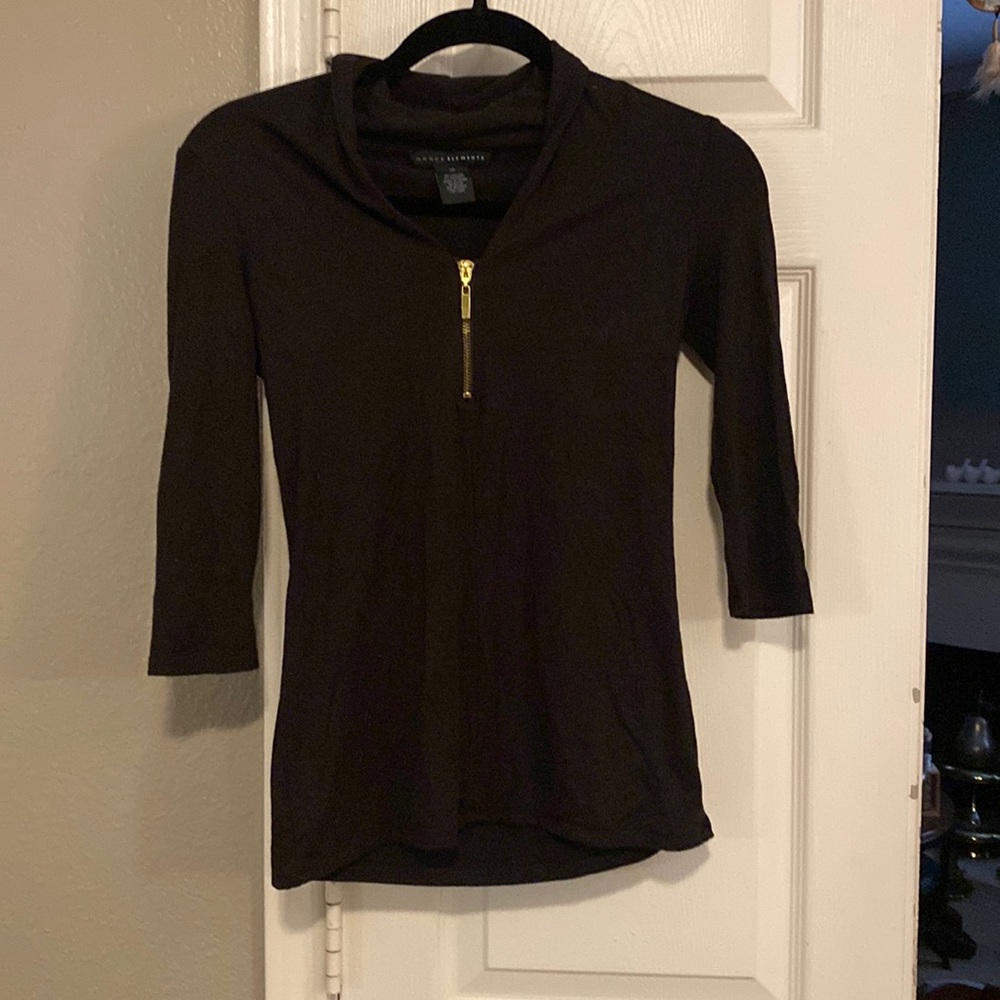 Quarter sleeve shirt with zipper detail! Very soft and flattering!